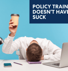 Image of a bored corporate employee head on the table holding a coffee cup.