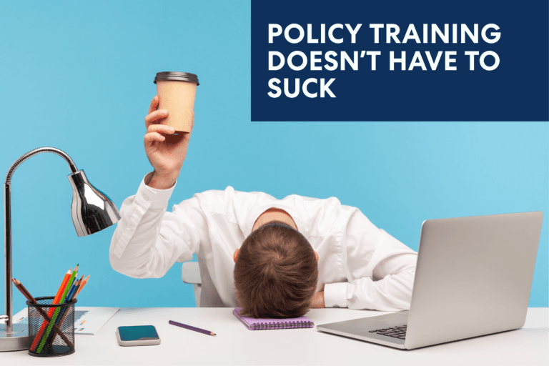 Image of a bored corporate employee head on the table holding a coffee cup.