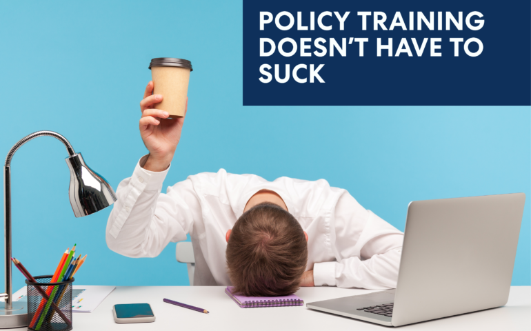 Image of a bored corporate employee head on the table holding a coffee cup.